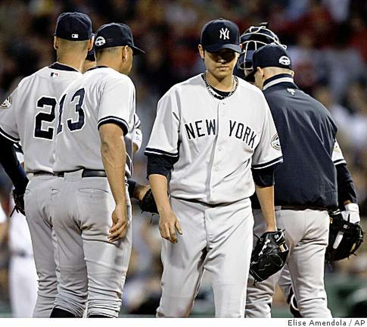 New York Yankees starting pitcher Chien-Ming Wang departs in the third inning against the Boston Red Sox during a baseball game at Fenway Park in Boston on Wednesday, June 10, 2009. (AP Photo/Elise Amendola)
