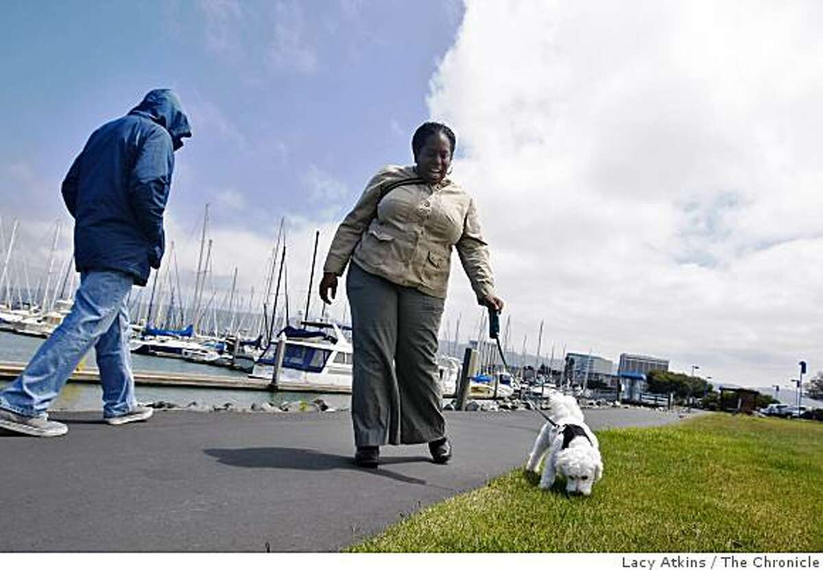 Marisha Anderson walks her dog Jack along the Emeryville Habor to "remind me of why we pay the high rents", Anderson said, Monday June 8, 2009, in Emeryville, Calif.