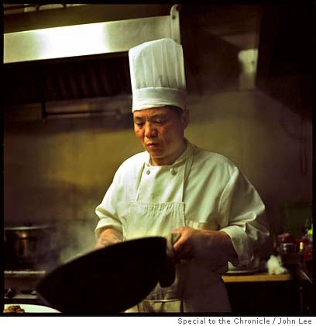 TOP 100 JAI YUN 04.jpg Chef Nei Chia Ji (cq) works with a wok in the kitchen at Jai Yun in San Francisco's Chinatown. By JOHN LEE/SPECIAL TO THE CHRONICLE Ran on: 04-01-2007 The main dining room at Thomas Kellers Ad Hoc in Yountville.