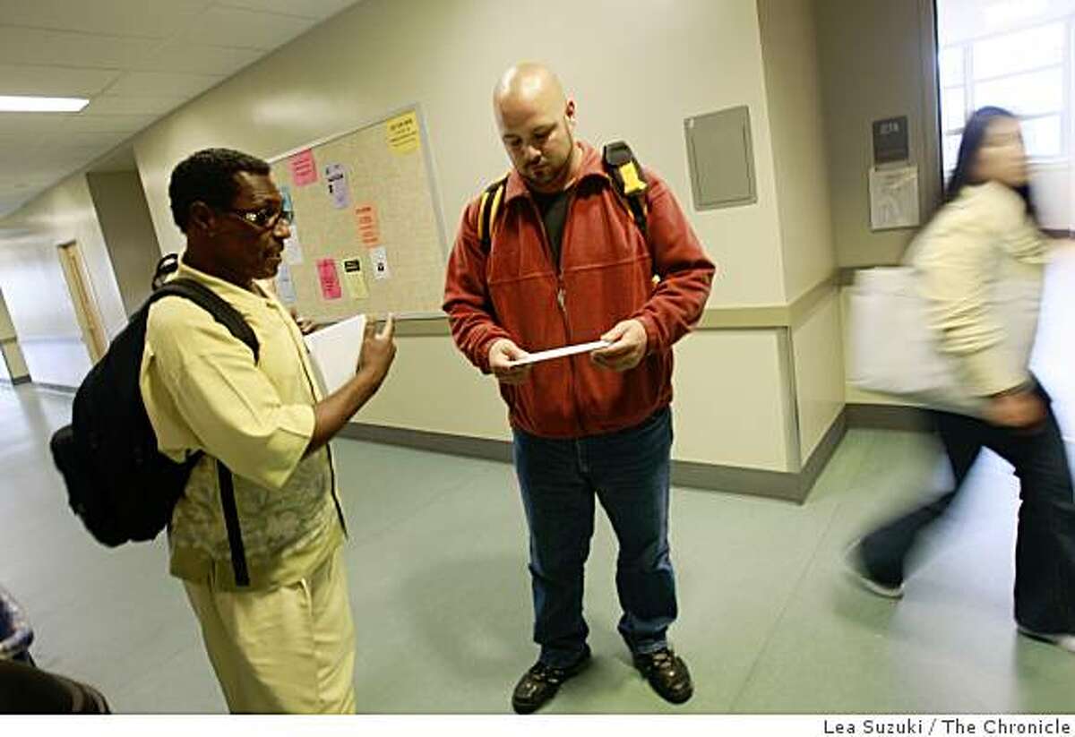 Eli Crawford (in yellow shirt) and Alex Humphrey (in red jacket) talk as they leave the City College Mission Campus in San Francisco, Calif. on Tuesday, June 16, 2009.