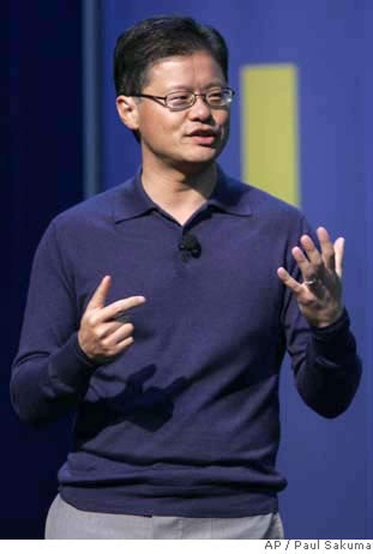 Yahoo CEO Jerry Yang gestures during his speech at the Consumer Electronics Show in Las Vegas, Jan. 6, 2008. Google Chief Executive Officer Eric Schmidt called Yang Friday to offer his help in repelling Microsoft, according to a report Sunday on The Wall Street Journal's Web site, which cited anonymous people familiar with the matter. (AP Photo/Paul Sakuma) JAN. 6, 2008 PHOTO. NOT A FILE.