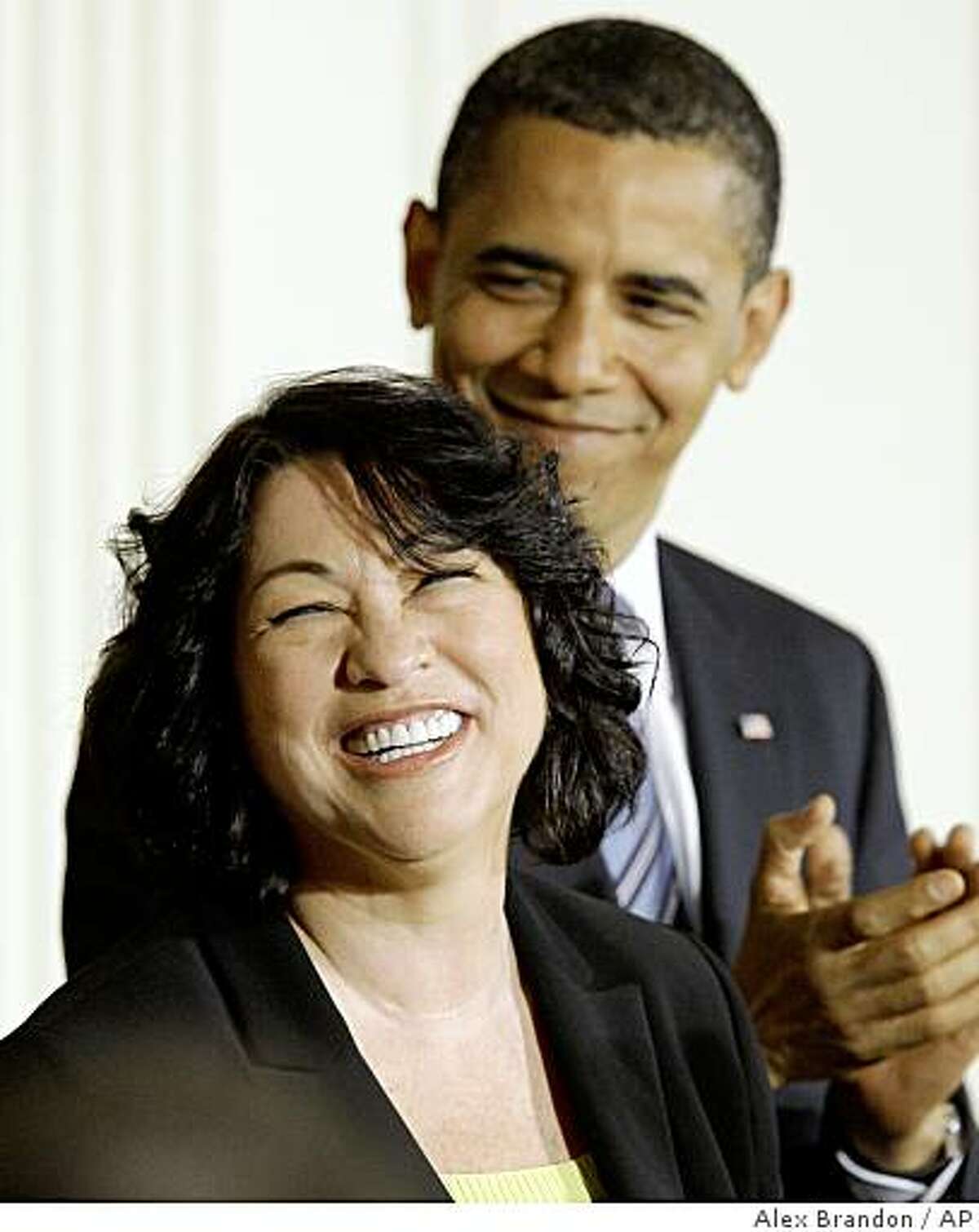 Supreme Court nominee Judge Sonia Sotomayor smiles as President Barack Obama applauds, Tuesday, May 26, 2009,in the East Room Ceremony of the White House in Washington. (AP Photo/Alex Brandon)
