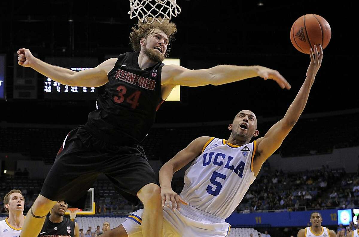 UCLA guard Jerime Anderson, right, puts up a shot as Stanford forward Andrew Zimmermann defends during the second half of their NCAA college basketball game, Thursday, Feb. 9, 2012, in Los Angeles. UCLA won 72-61.