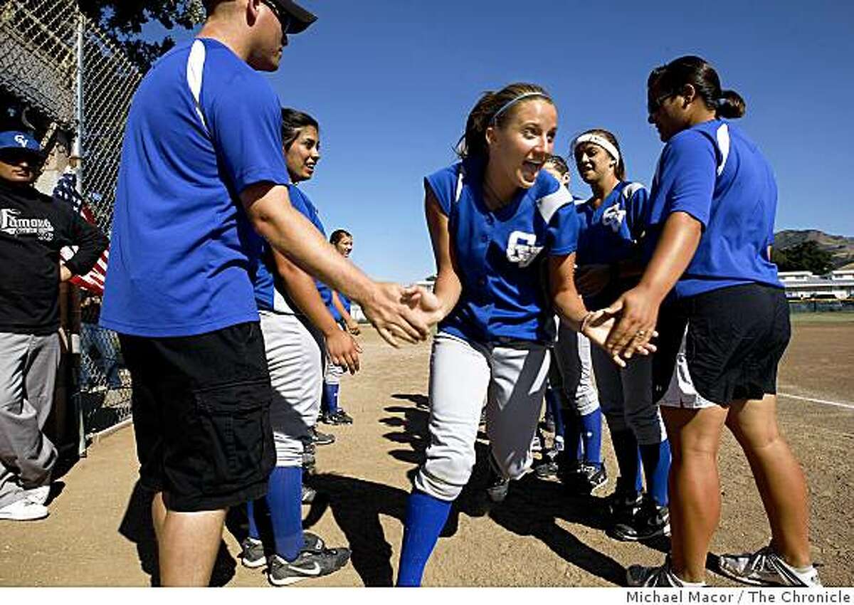 Tori Kobold of the Clayton Valley High softball take the field during introductions in a first round game of the North Coast finals in Concord, Ca. on Wednesday May 20, 2009. The Mt. Diablo School District is dropping it's sports programs at every school starting next year.