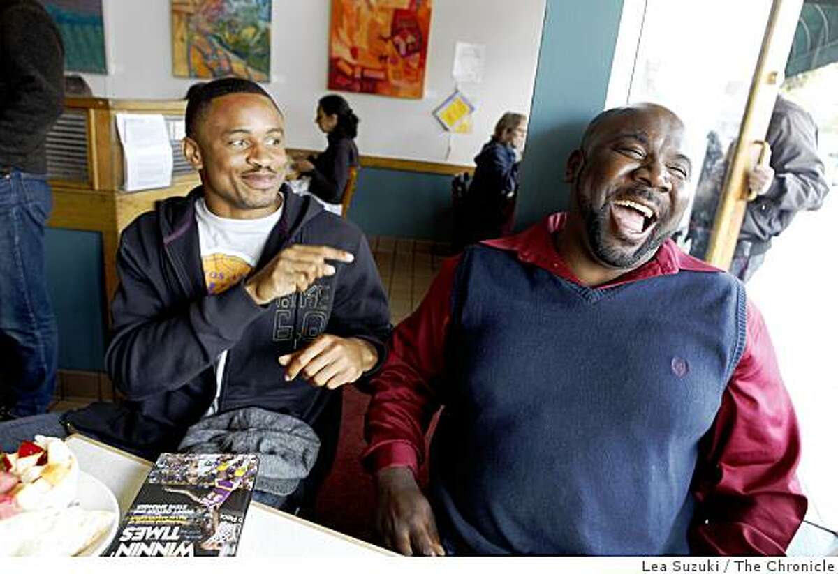 Raiders cornerback Nnamdi Asomugha (l to r) shares a laugh with East Bay prep coach Alonzo Carter at the Rockridge Cafe in Oakland, Calif. on Sunday, May 24, 2009.