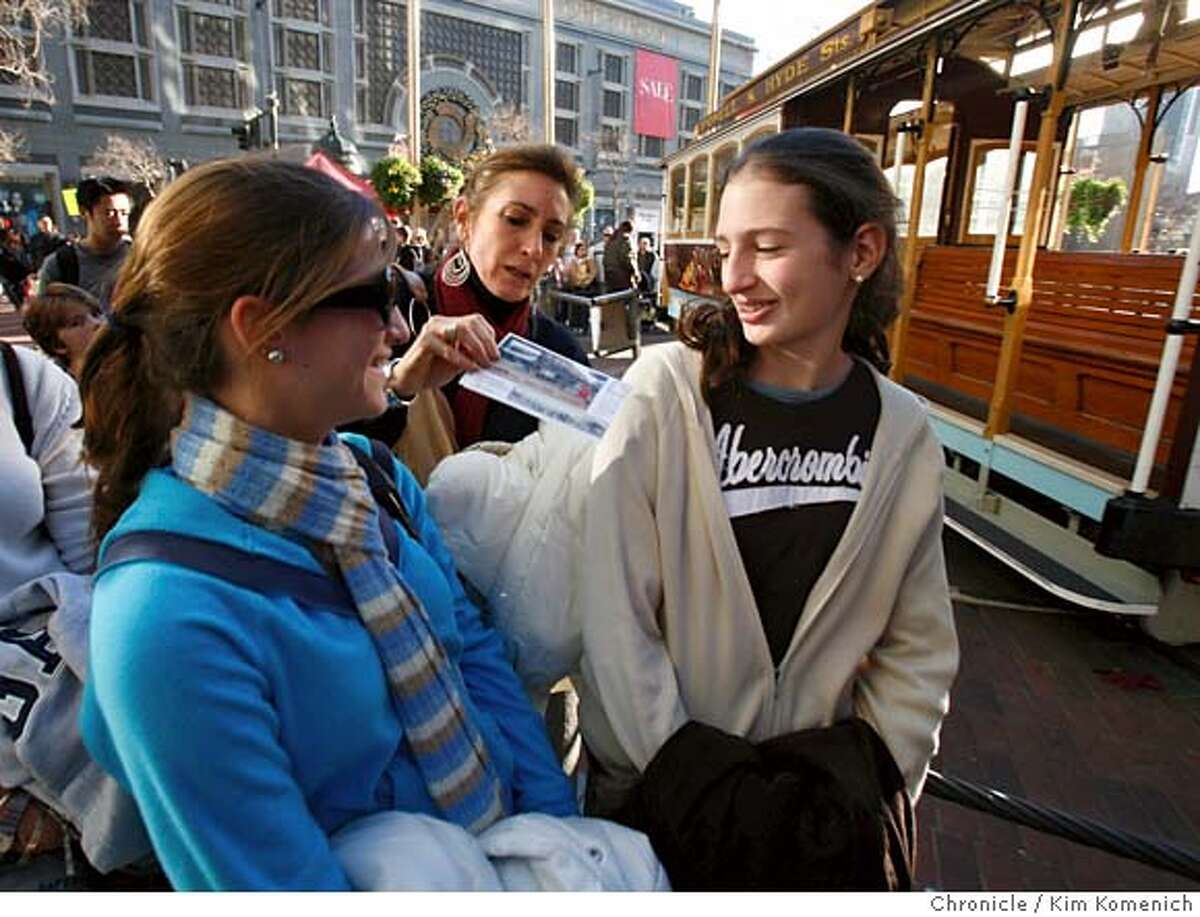 TOURISM06_095_KK.JPG Maria Virginia De Lima, center, distributes cable car tickets to her second cousin Angela Gers, 18, left and daughter Natalia Rivera, right. Angela is visiting from Florida and Maria Virginia and Natalia are visiting from Cali, Colombia. They are among tourists from around the world who are taking advantage of the dollar's plunge and visiting the United States. Ironically, the economies of tourist destinations like San Francisco stand to benefit from the dollar's drop. Photo by Kim Komenich/The Chronicle **Maria Virginia De Lima, Natalia Rivera, Angela Gers MANDATORY CREDIT FOR PHOTOG AND SAN FRANCISCO CHRONICLE. NO SALES- MAGS OUT.