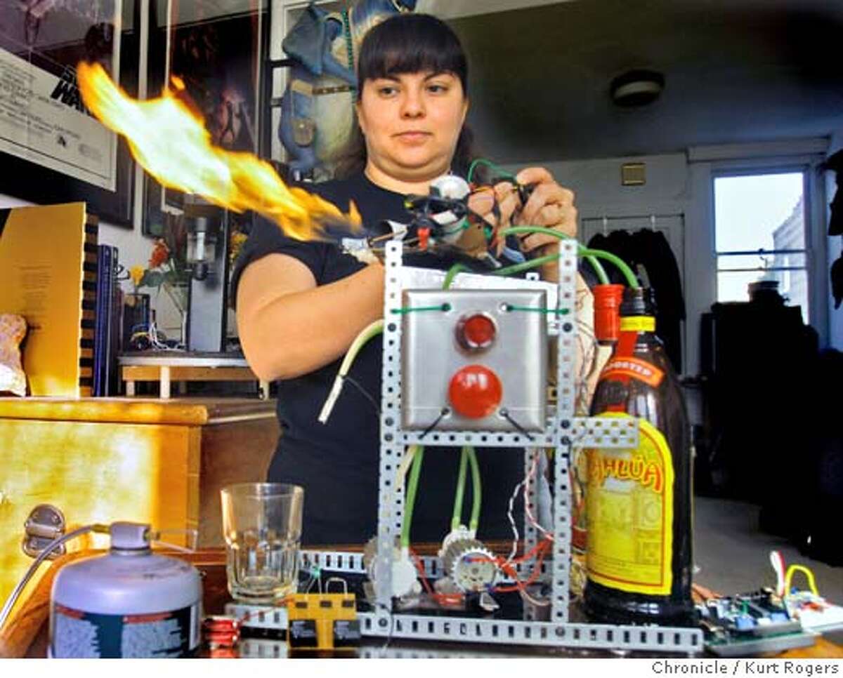 Simone Davalos who is a robot builder she came up with a robot that makes mixed coffee drinks then flames them. ROBOFAMILY_0068_KR.jpg Kurt Rogers / The Chronicle Photo taken on 11/13/07, in San Francisco, CA, USA Ran on: 12-09-2007 Ran on: 12-09-2007