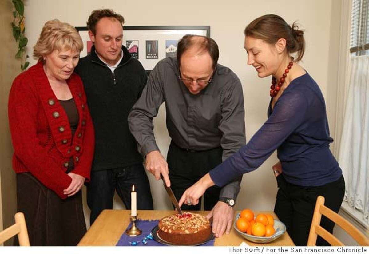 Nichole Spiridakis made a St. Basil's Day cake as part of a celebration for the Greek holiday at her home in San Francisco, Calif., Friday, Dec. 21, 2007. The cake is covered with pomegranate seeds and has a coin hidden inside, the person who gets the piece with the coin is supposed to have good luck for the new year. Thor Swift For The San Francisco Chronicle