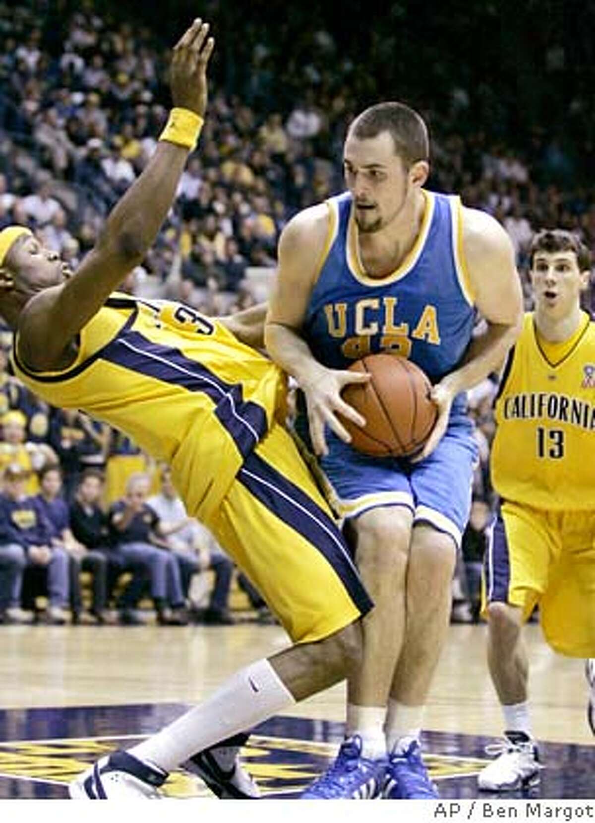 UCLA's Kevin Love (42) drives into California's DeVon Hardin, left, during the first half of a college basketball game Saturday, Jan. 5, 2008, in Berkeley, Calif. (AP Photo/Ben Margot) EFE OUT