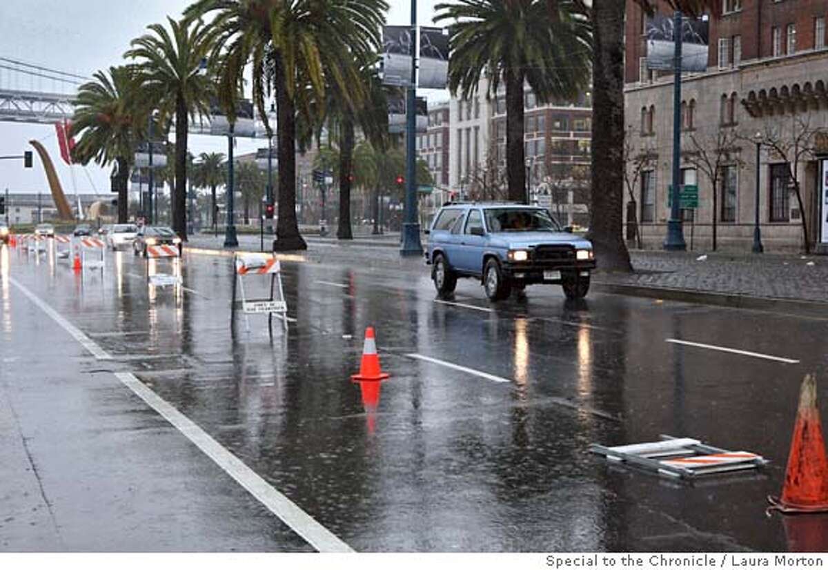 Weather05_SF_0167_LKM.jpg One lane of the Embarcadero was blocked off Friday morning due to flooding from the storm. (Laura Morton/Special to the Chronicle)