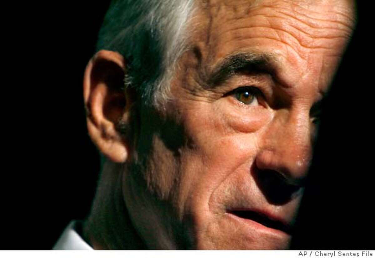 ** FILE ** Republican presidential hopeful, Rep. Ron Paul, R-Texas, talks to The Associated Press during an interview at Nashua High School South, in Nashua N.H. Wednesday Nov. 7, 2007. Those who dismissed Rep. Ron Paul as a joke in the Republican presidential primary aren't laughing so hard these days. (AP Photo/Cheryl Senter, File)A NOV. 7, 2007 FILE PHOTO