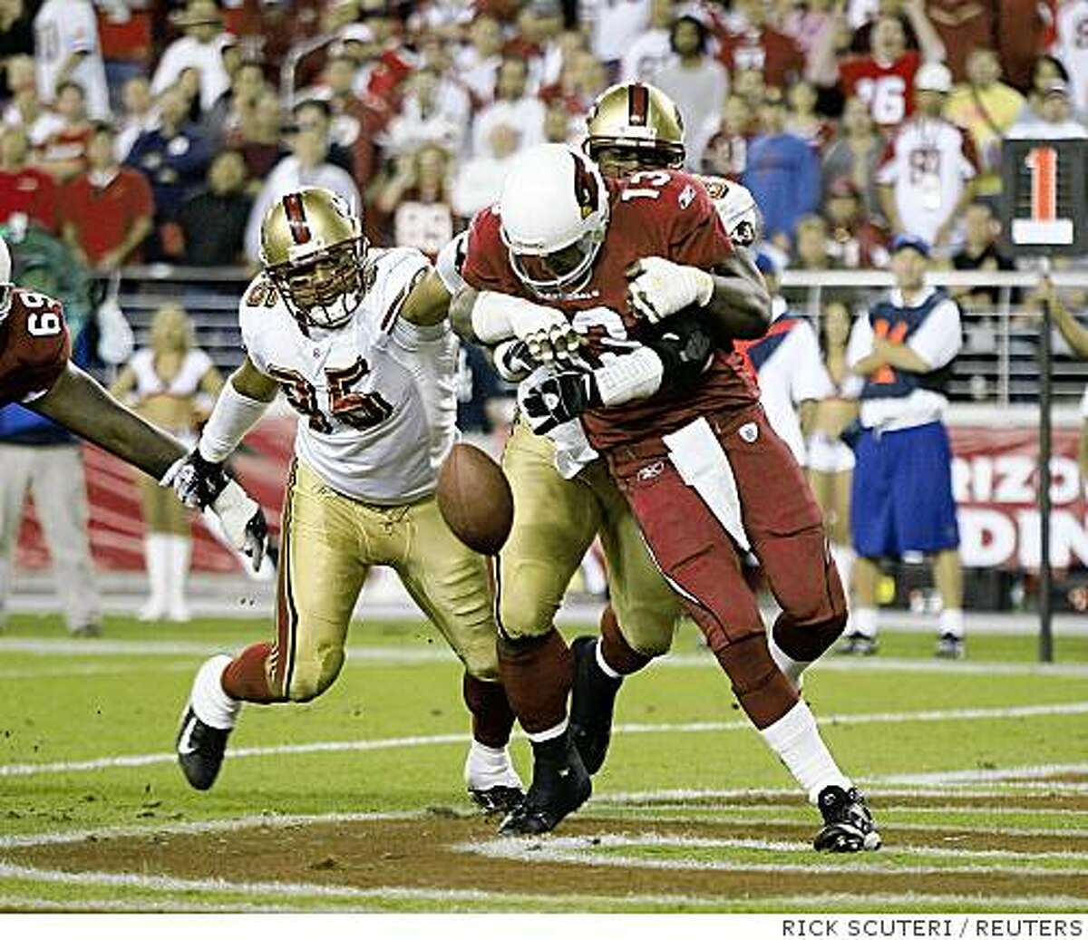 History: San Francisco 49ers defensive tackles Ronald Fields and Tully Banta-Cain (95) sack Arizona Cardinals quarterback Kurt Warner in the end zone causing him to fumble in over-time during their NFL game in Glendale, Arizona, November 25, 2007. Banta-Cain recovered the fumble for a touch down giving the 49ers a 37-31 win. REUTERS/Rick Scuteri (UNITED STATES)Ran on: 11-26-2007The 49ers' Ronald Fields wraps up Cardinals QB Kurt Warner in the end zone, setting up an improbable win in overtime.Ran on: 11-26-2007The 49ers' Ronald Fields wraps up Cardinals QB Kurt Warner in the end zone, setting up an improbable win in overtime. San Francisco 49ers defensive tackles Ronald Fields and Tully Banta-Cain (95) sack Arizona Cardinals quarterback Kurt Warner in the end zone causing him to fumble in over-time during their NFL game in Glendale, Arizona, November 25, 2007. Banta-Cain recovered the fumble for a touch down giving the 49ers a 37-31