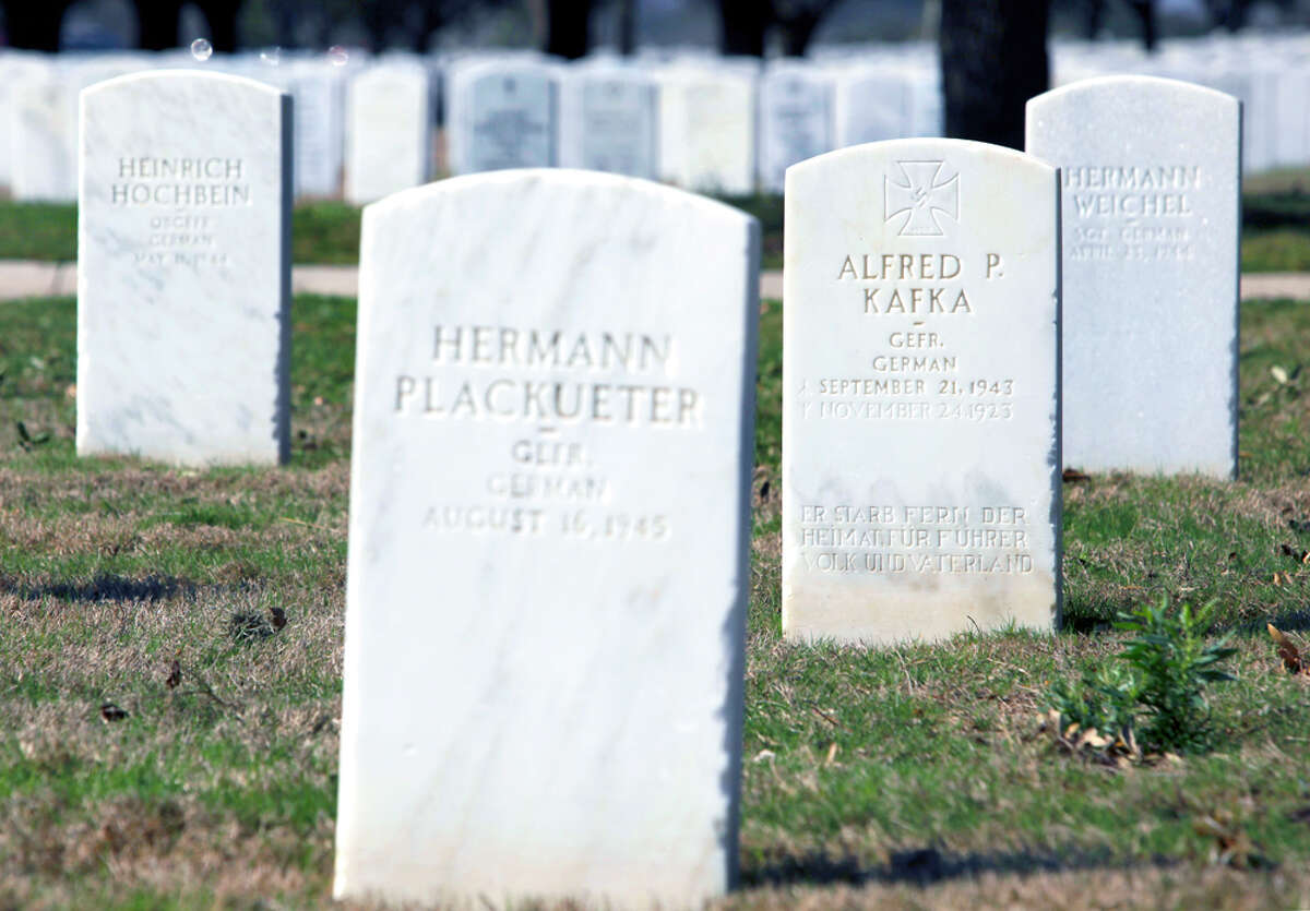 Grave markers for World War II prisoners of War are seen Tuesday, Feb. 7, 2012 at Fort Sam Houston National Cemetery. Some 141 POWs are interred at the cemetery normally reserved for U.S. veterans and their spouses.