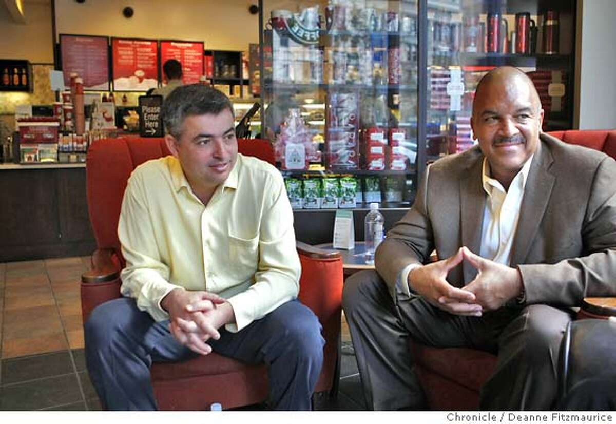 apple08_102_df.jpg (l to r) Eddy Cue (cq) Apple's VP of iTunes and Ken Lombard, President of Starbucks Entertainment were at the 3rd Street Starbucks for the demonstrations. Apple's iTunes Wi-Fi Store will launch Thursday in Starbucks coffee shops throughout San Francisco. This partnership allows Apple customers to sync to Starbucks wireless internet network instantly from their iPods Touch, Macs and iPhones and download music. Photographed in San Francisco on 11/7/07. Deanne Fitzmaurice / The Chronicle