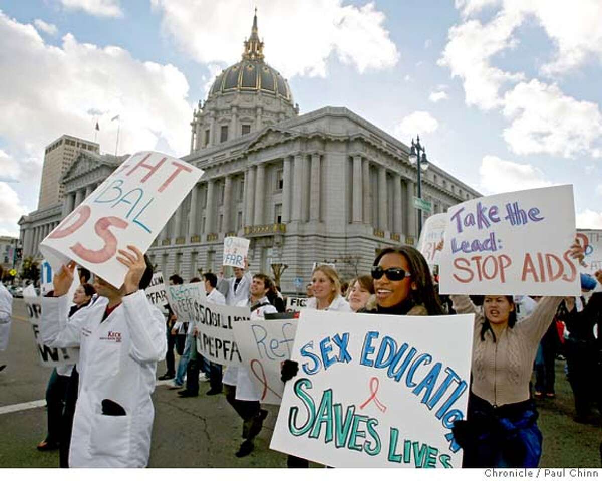 Medical school students marched before a rally on the steps of City Hall to call for reform in the President's Emergency Plan for AIDS Relief in San Francisco, Calif. on Saturday, Dec. 1, 2007. The event, scheduled to coincide with World AIDS Day, was one of three rallies held across the country. PAUL CHINN/The Chronicle