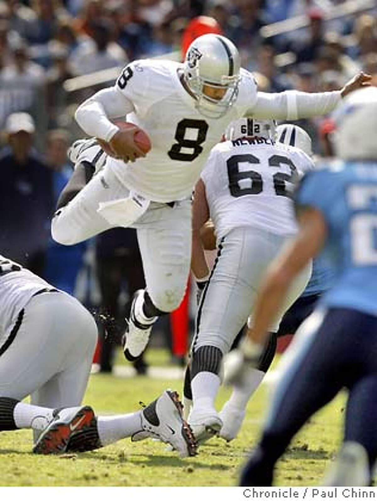 Quarterback leaps over linemen while scrambling in the second quarter of the Oakland Raider vs. Tennessee Titans NFL game at LP Field in Nashville, Tenn. on Sunday, Oct. 28, 2007. PAUL CHINN/The Chronicle