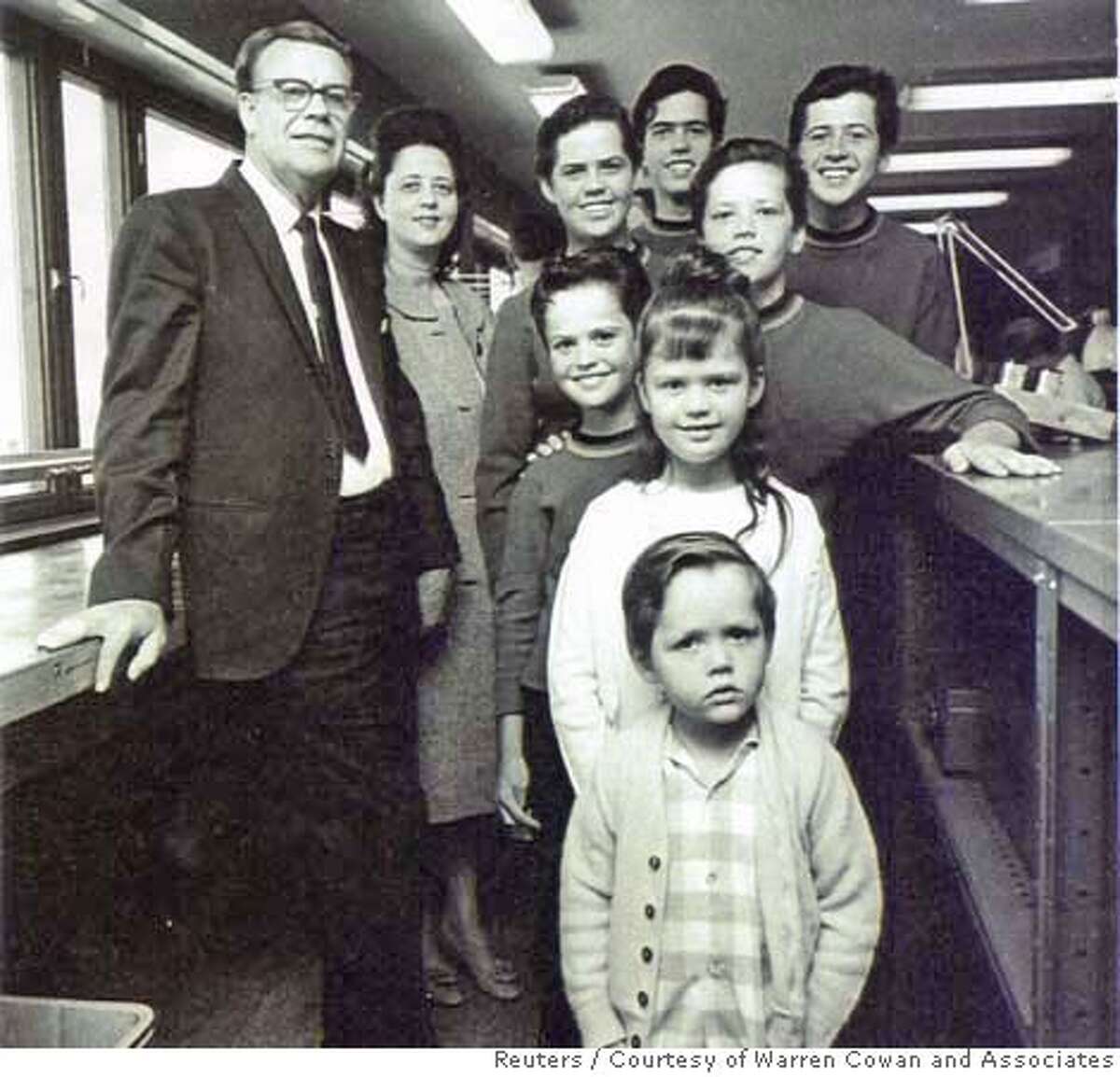 George (L) and Olive Osmond are pictured with the Osmond children in this undated photograph. The other members of the Osmond family are (from top L-R): Alan, Wayne, Merrill and Jay Osmond, and (C, front to back) Jimmy, Marie and Donny.