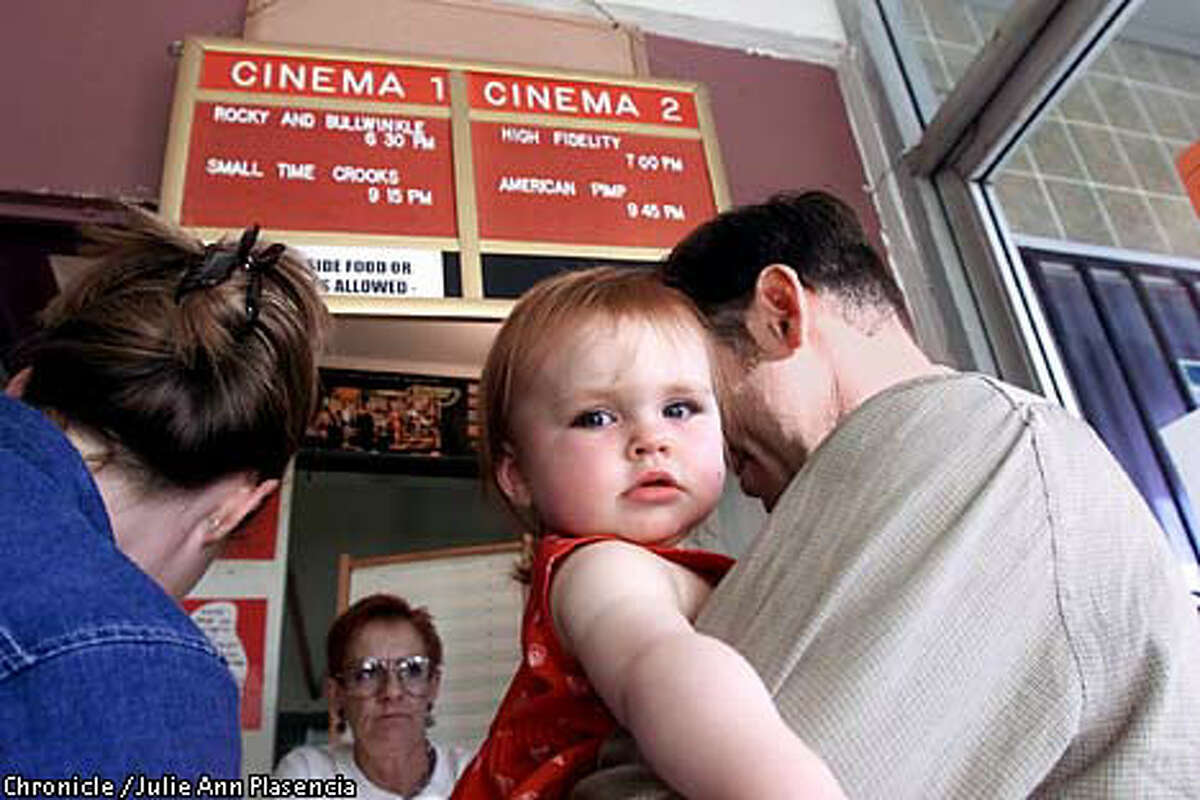 FILE - In this July 31, 2000 photo, ten-month-old Grace Jewell Brown waits for her parents to purchase tickets at Baby Brigade night at Oakland's Parkway Theater.