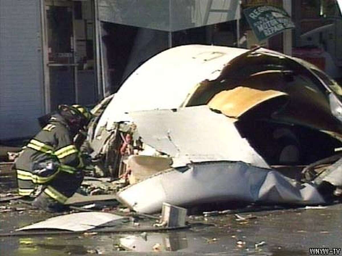 Fiery N.Y. Jet Crash / Plane nosedives into crowded neighborhood after