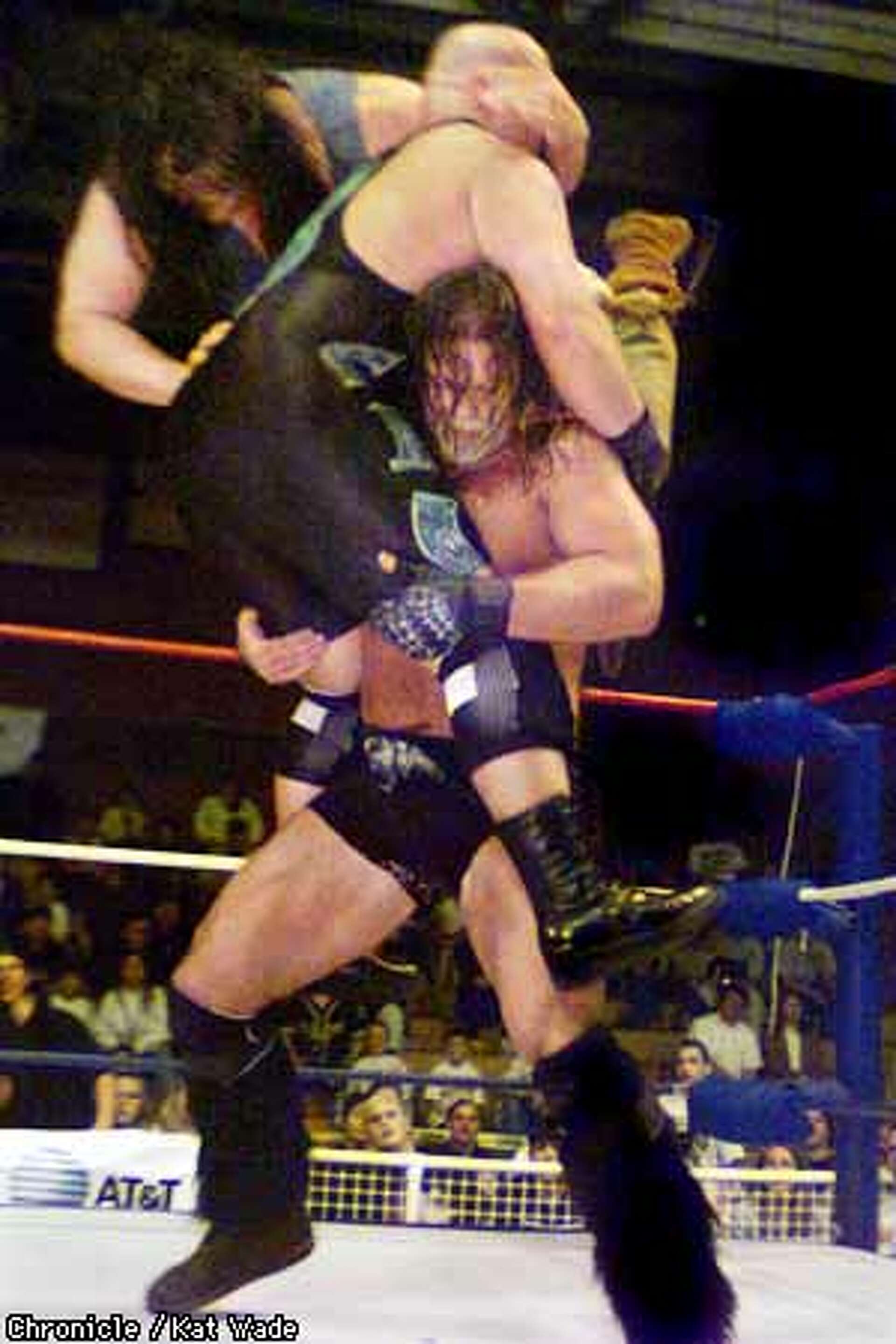 THE PATIENT ``PITBULL'' / Wrestler rages in the ring but provides