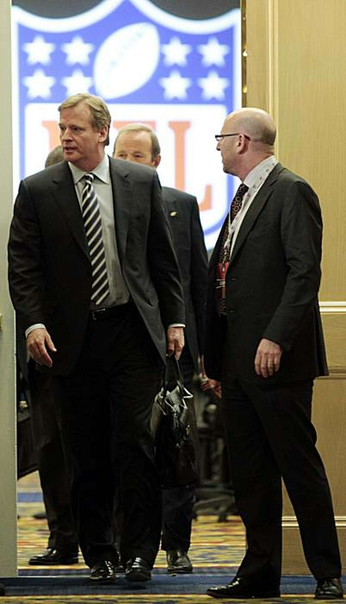 NFL commissioner Roger Goodell, left, leaves a meeting with NFL owners at a hotel in Chantilly, Va., Wednesday, March 2, 2011. NFL owners ended their special labor meeting without taking any action, just 30 hours before the collective bargaining agreementwith the football players expires.