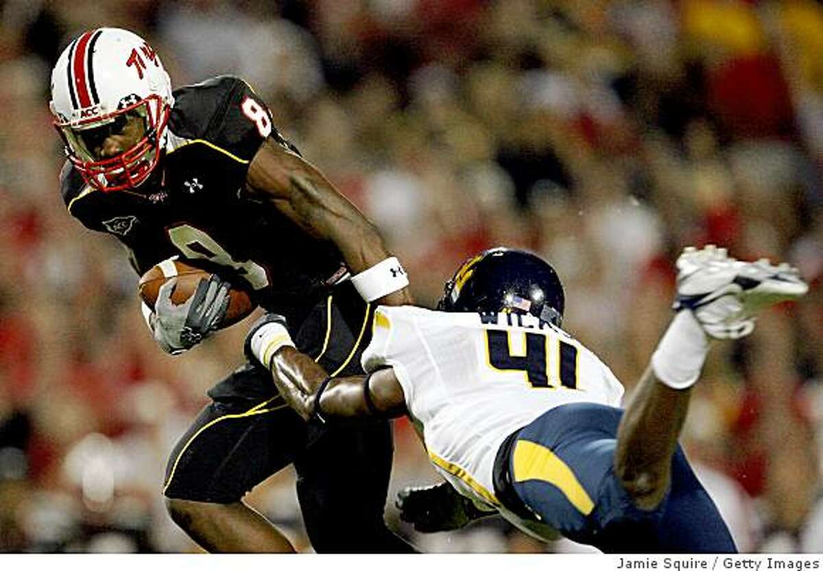 COLLEGE PARK, MD - SEPTEMBER 13: Receiver Darrius Heyward-Bey #8 of the Maryland Terrapins evades Eric Wicks #41 of the West Virginia Mountaineers after making a reception during the 1st quarter of the game on September 13, 2007 at Byrd Stadium in College Park, Maryland. (Photo by Jamie Squire/Getty Images)