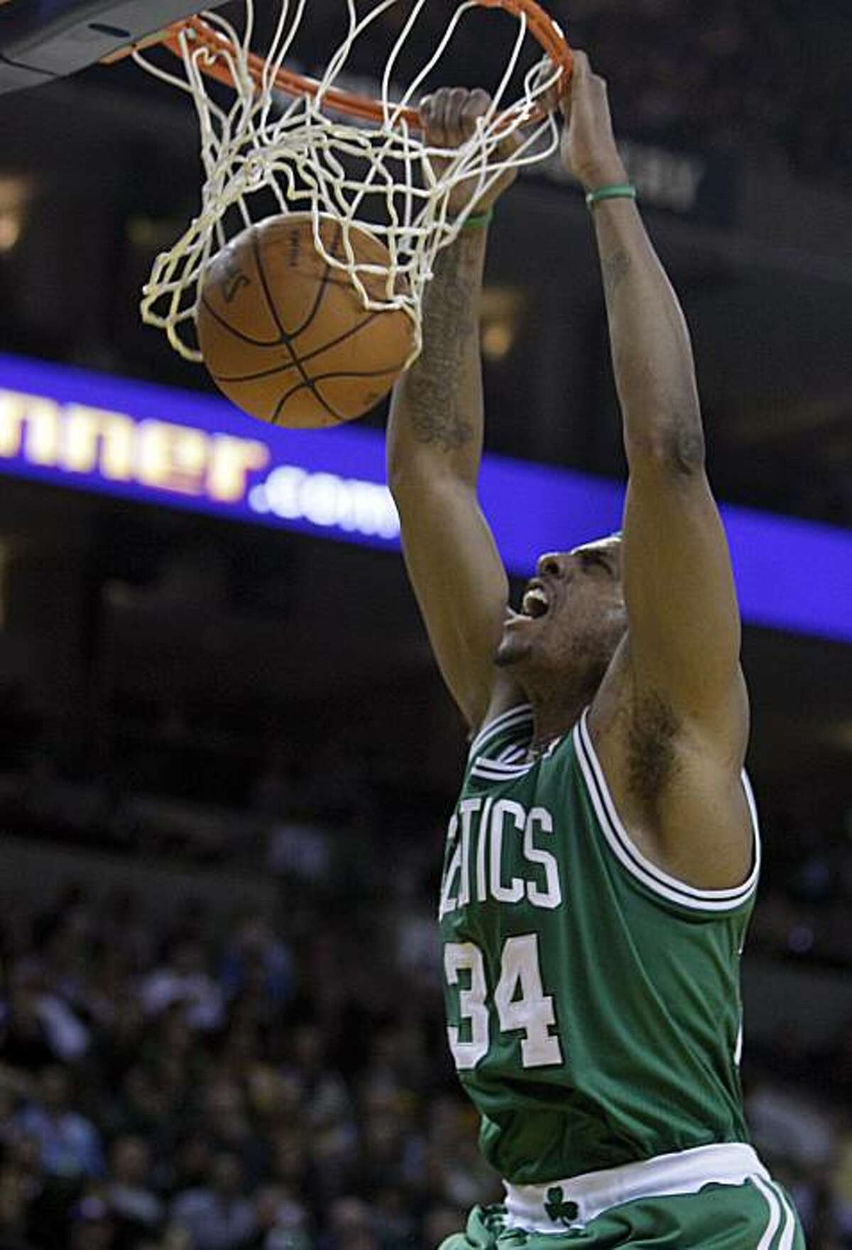 Boston Celtics' Paul Pierce scores against the Golden State Warriors during the second half of an NBA basketball game Tuesday, Feb. 22, 2011, in Oakland, Calif.