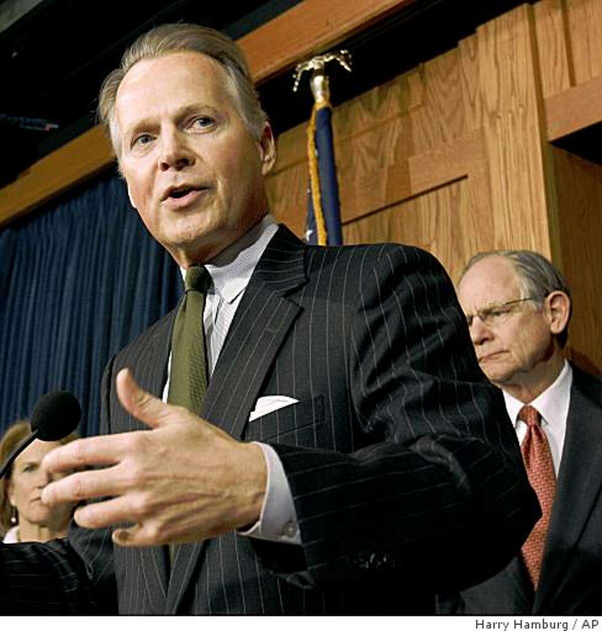 Rep. David Dreier R-Calif., flanked by Rep. Shelley Moore Capito R-W.Va., left, and Rep. Mike Castle R-Del., gestures during a news conference on Capitol Hill in Washington, Wednesday, March 25, 2009, to discuss the budget. (AP Photo/Harry Hamburg)