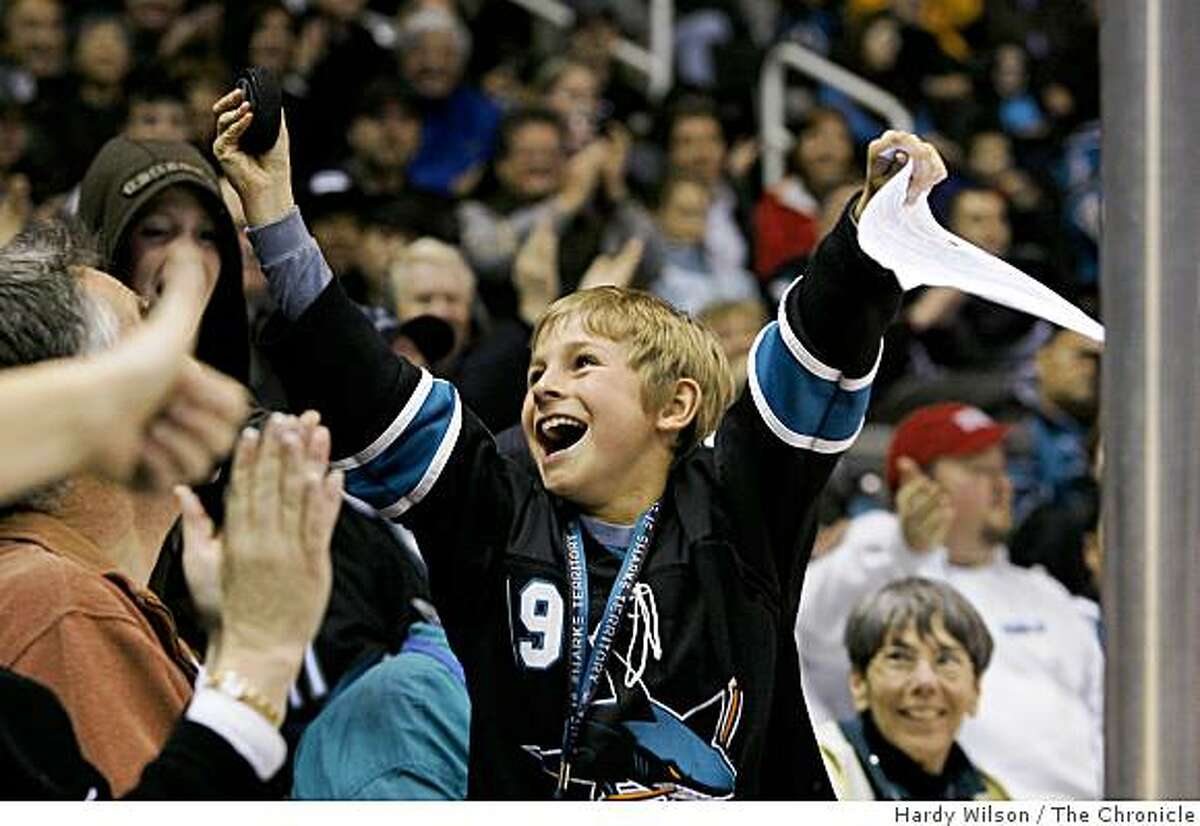 Matt Heitel, 10, of Redwood City, Calif., attending his first hockey game, reacts after picking up a puck that landed in front of him during a match between the San Jose Sharks and the Edmonton Oilers at the HP Pavilion on Tuesday, February 17, 2009 in San Jose, Calif. The Sharks beat the Oilers 4-2.