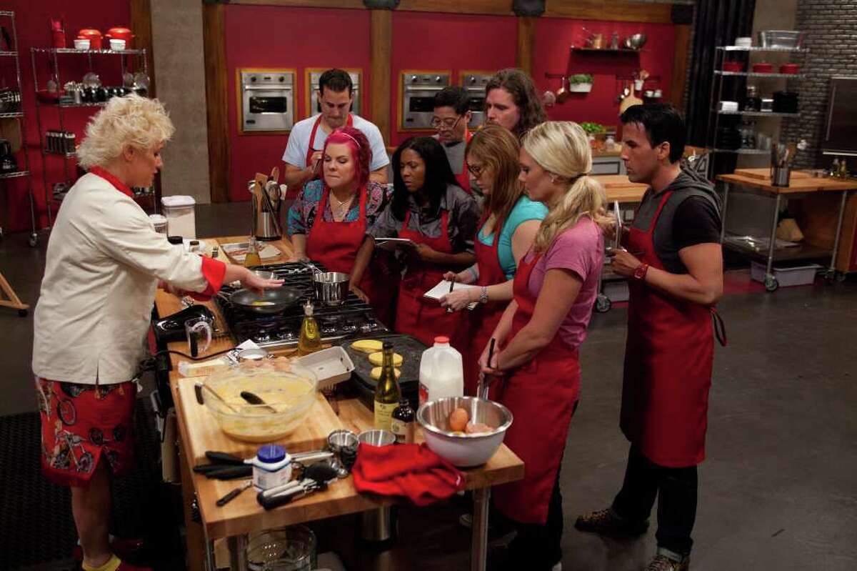 Celebrity chef Anne Burrell instructs her team the Food Network's Worst Cooks in America. The third season premieres Sunday, Feb. 12. On Team Burrell is Dorothy Strouhal (center with pink hair) of Cove, Tx. in Chambers County.