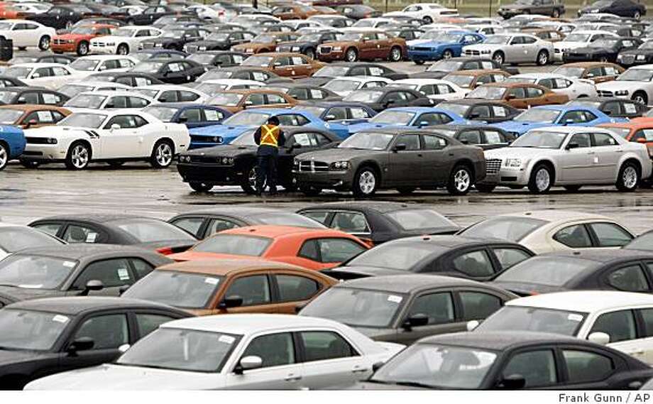 Did Chrysler Reject Aid Over Limits On Pay Sfgate A Lot Attendant Inspects One Of Hundreds Chrysler Cars Sitting Ready For Final Embly And