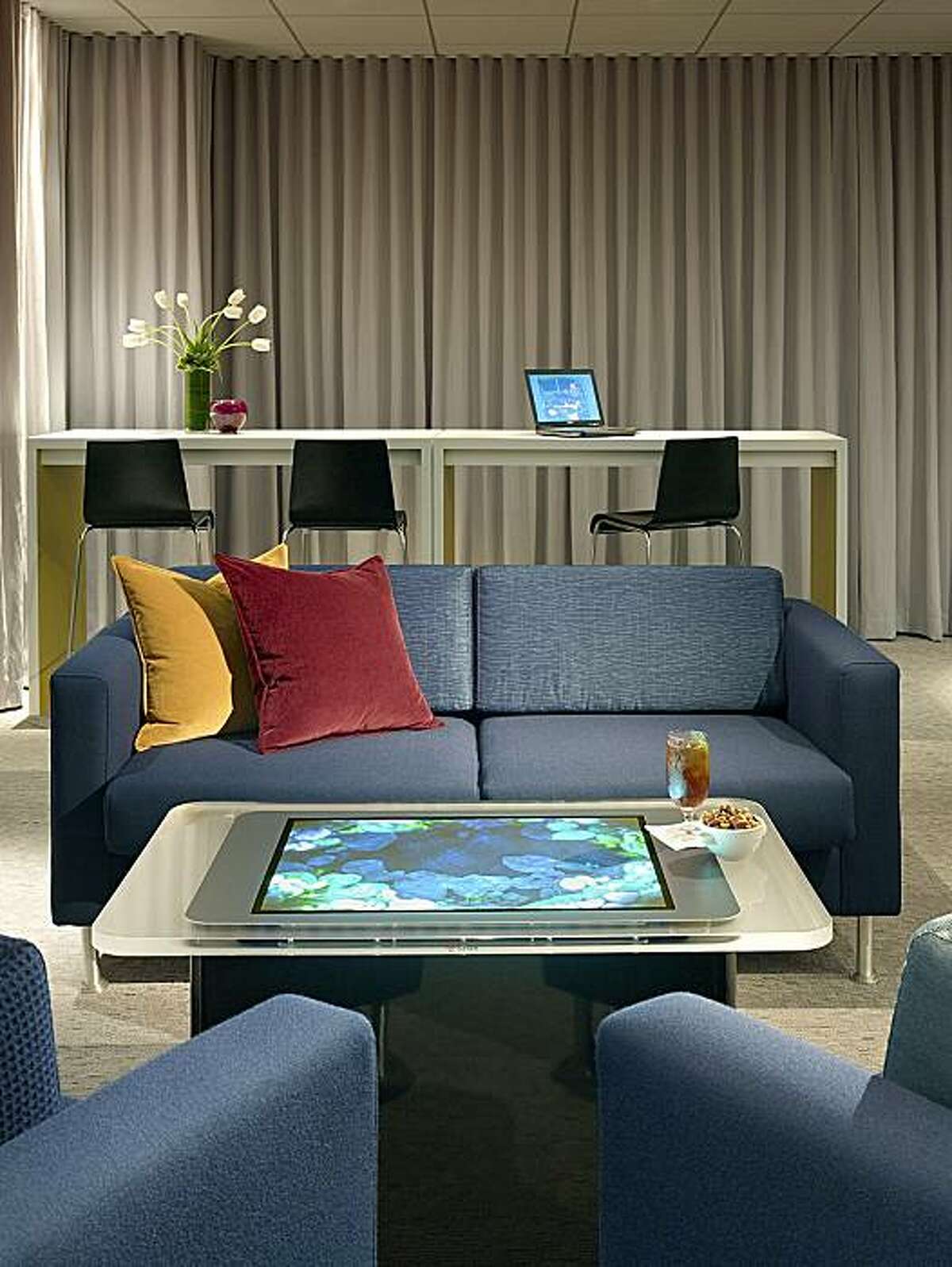 The Microsoft Surface coffee table at the Fairmont?s new Intersect media lounge is a precursor of interactive furniture to come.