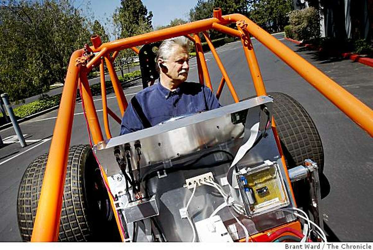 Adura CEO Marvin Bush takes the engineering prototype vehicle for a spin around the parking lot of their Menlo Park laboratory. Adura, a Silicon Valley company, makes powertrains for electric buses. They use multiple battery modules instead of one large battery.