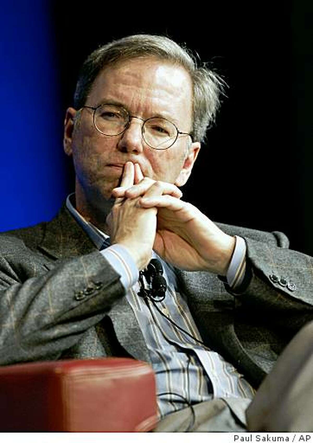 In this Oct. 27, 2008 photo, Google CEO Eric Schmidt ponders a question during a meeting at Google headquarters in Mountain View, Calif. Google Inc. on Thursday, April 16, 2009 announced it eked out a higher profit in the first quarter as the Internet search leader trimmed its work force and winnowed other expenses to overcome the slowest revenue growth since since the company went public nearly five years ago. (AP Photo/Paul Sakuma)