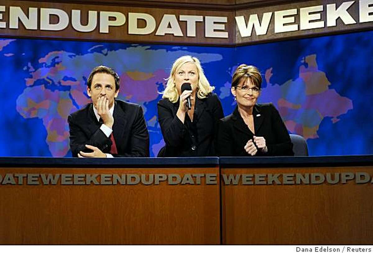 Cast members Amy Poehler (C) and Seth Meyers (L) perform a skit with Republican vice-presidential nominee Alaska Governor Sarah Palin during an episode of "Saturday Night Live" in New York October 18, 2008. REUTERS/Dana Edelson/Handout (UNITED STATES). NO SALES. NO ARCHIVES. FOR EDITORIAL USE ONLY. NOT FOR SALE FOR MARKETING OR ADVERTISING CAMPAIGNS.