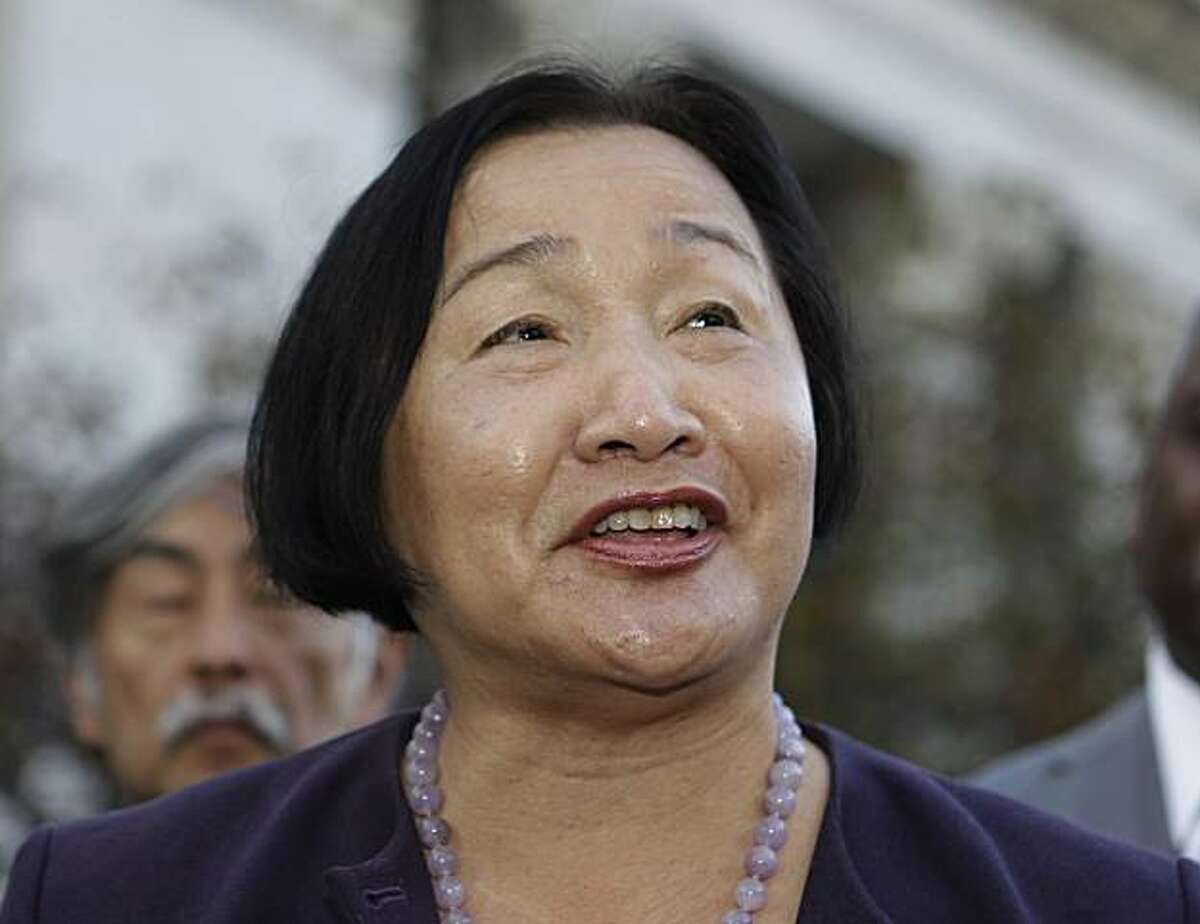 Oakland Councilwoman Jean Quan smiles during a news conference in front of Oakland City Hall in Oakland, Calif., Monday, Nov. 8, 2010. The once-crowded, 10-candidate race for Oakland's mayor is down to Quan holding a slight lead over former state Sen. DonPerata, who was ahead after initial first-choice votes were tallied early last week.