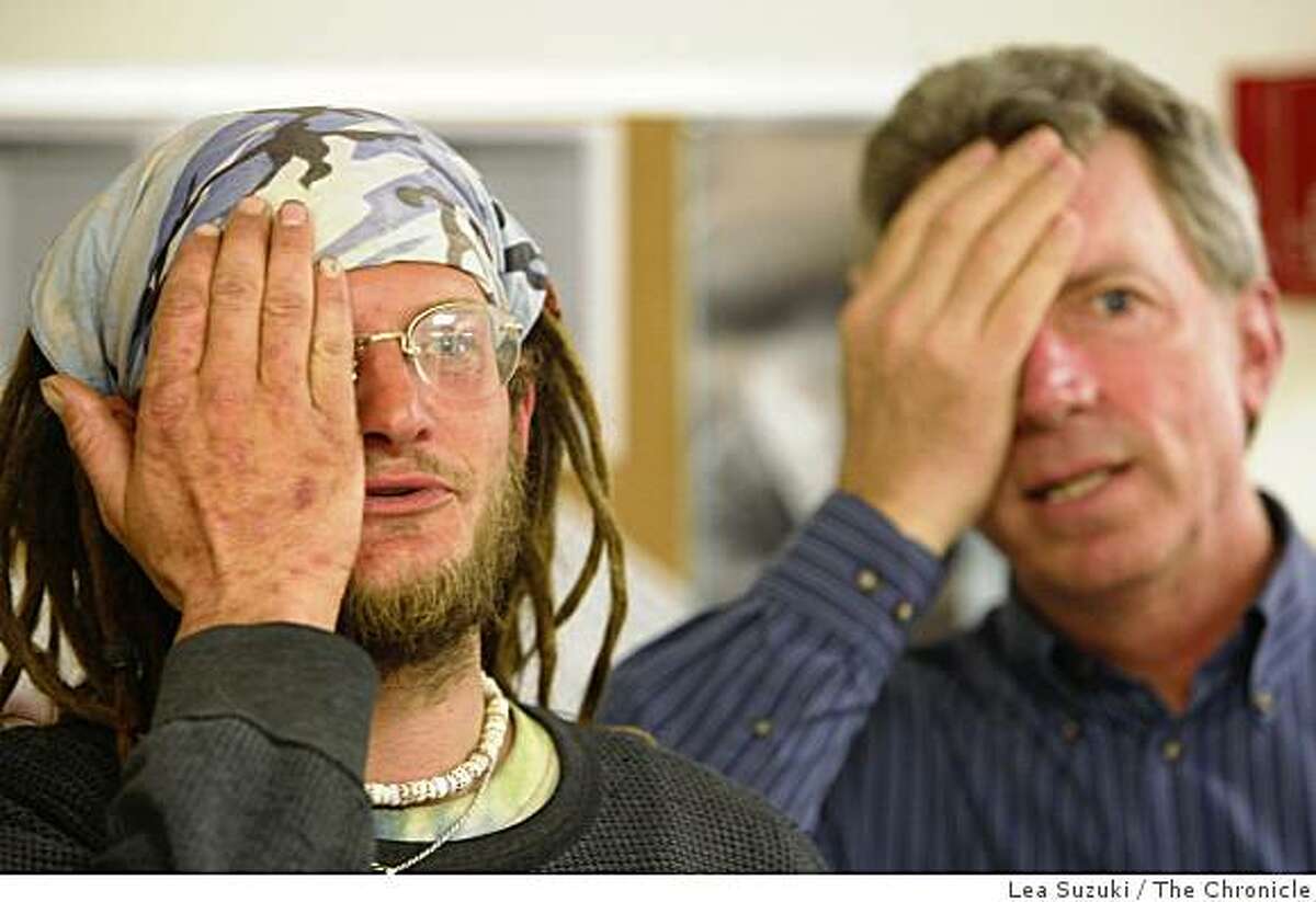 Kevin O'Brien (right), volunteer explains to Joshua Gift (left) of Half Moon Bay how to take the eye test in Half Moon Bay, Calif. on Wednesday March 25, 2009.