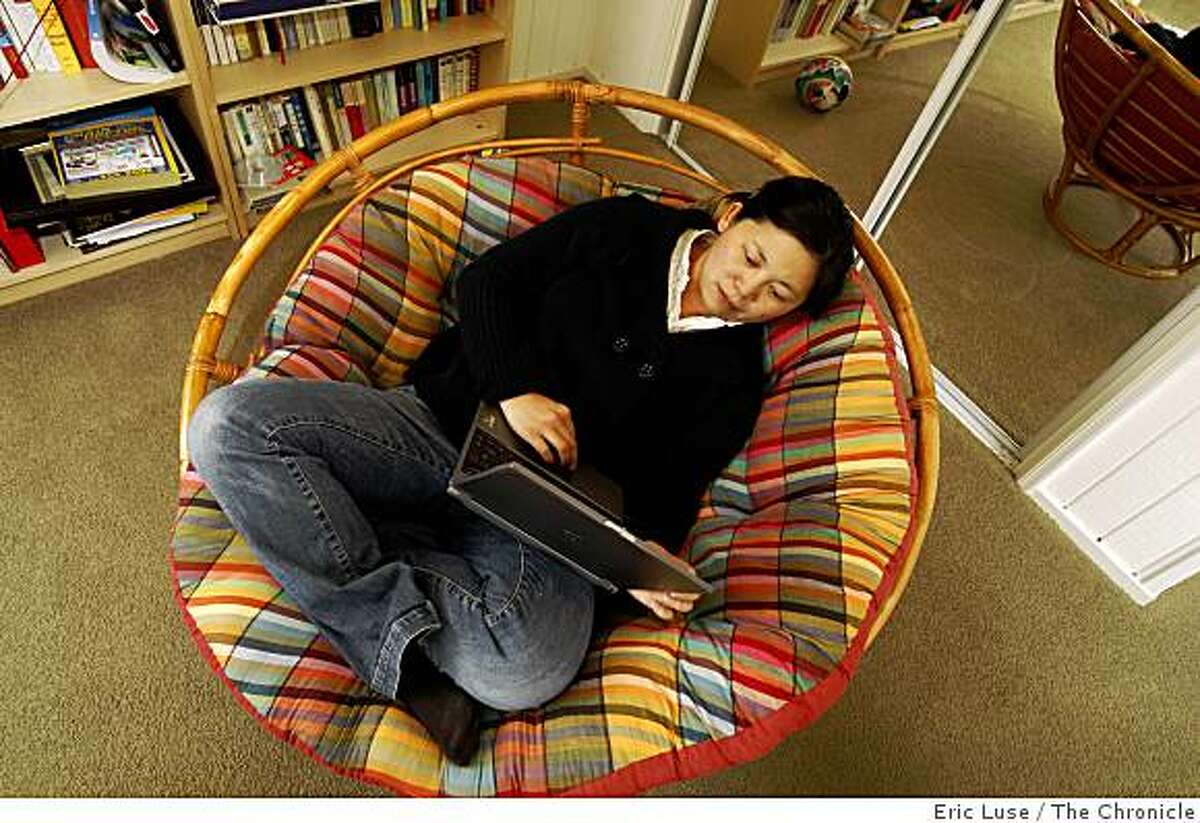Author Yiyun Li spent many hours on this oversized chair in her Oakland home office researching for her new book "The Vagrants" photographed on Friday, February 27, 2009.