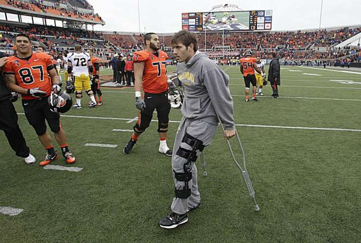 California's quarterback Kevin Riley (13) walks off the field on crutches following NCAA college football game with Oregon State Saturday, Oct. 30, 2010, in Corvallis, Ore. Oregon State defeated California 35-7.