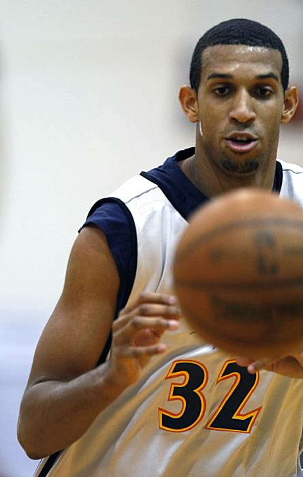 Brandan Wright passes off during the Warriors first training camp in Oakland Ca. Sept 29, 2009