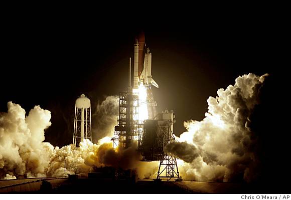 Discovery roars into orbit with a 'beautiful launch'