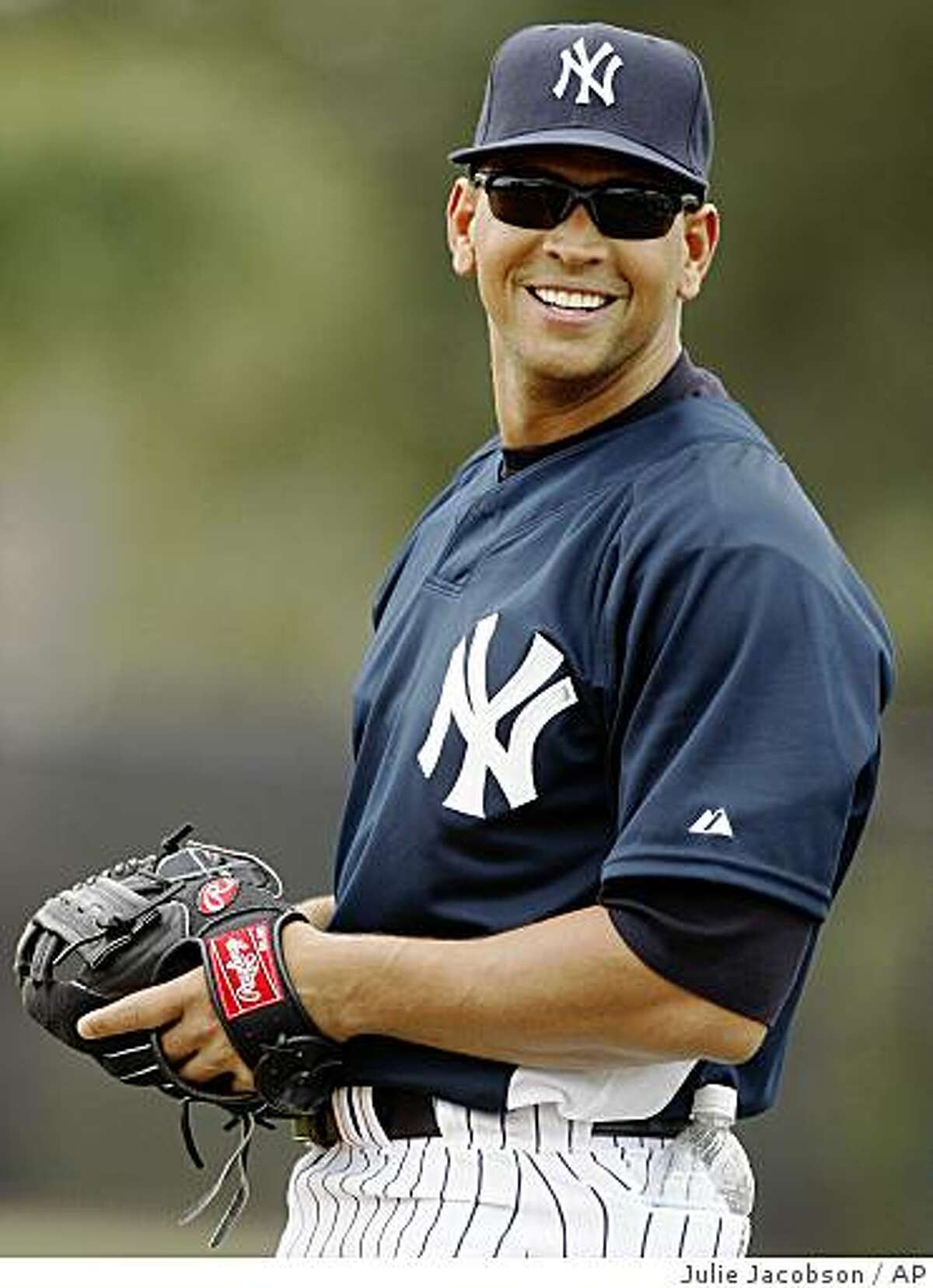 ** FILE ** In this Feb. 20, 2008 file photo, New York Yankees third baseman Alex Rodriguez glances back at fans while warming up during spring training baseball workouts in Tampa, Fla. How A-Rod responds to a report that he tested positive for steroids in 2003 will likely frame his pursuit of the career home run record and could define his playing days in the view of fans and Hall of Fame voters. (AP Photo/Julie Jacobson, File)
