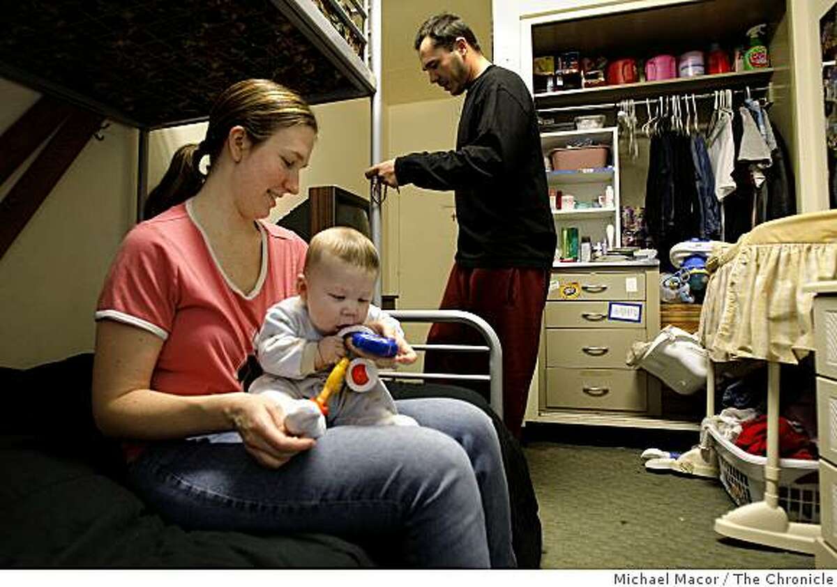 Stacey and Jesse Marwick moved into the center 6 months ago while Stacey was pregnant with her son Nicholas. The family inside their room at the InnVision Clara Mateo Alliance, in Menlo Park, Calif., on Friday Feb. 27, 2009. Nicholas is 5 months old. The center which serves singles and families, has seen private donations, government and foundation support fall dramatically due to the current recession.