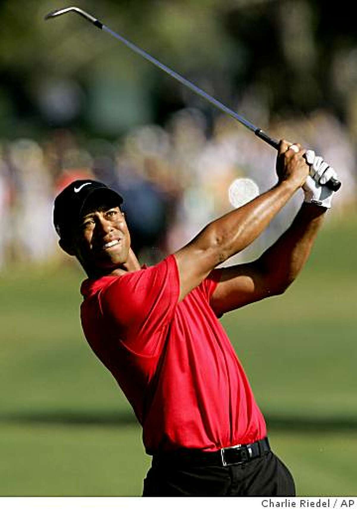 ** CORRECTS TO 253-DAY BREAK FROM 254-DAY BREAK ** FILE ** In this June 15, 2008, file photo, Tiger Woods tees off during the fourth round of the US Open championship at Torrey Pines Golf Course on in San Diego. Woods said on his Web site Thursday that he will defend his title next week in the Accenture Match Play Championship after a 253-day break from competition. (AP Photo/Charlie Riedel, File)