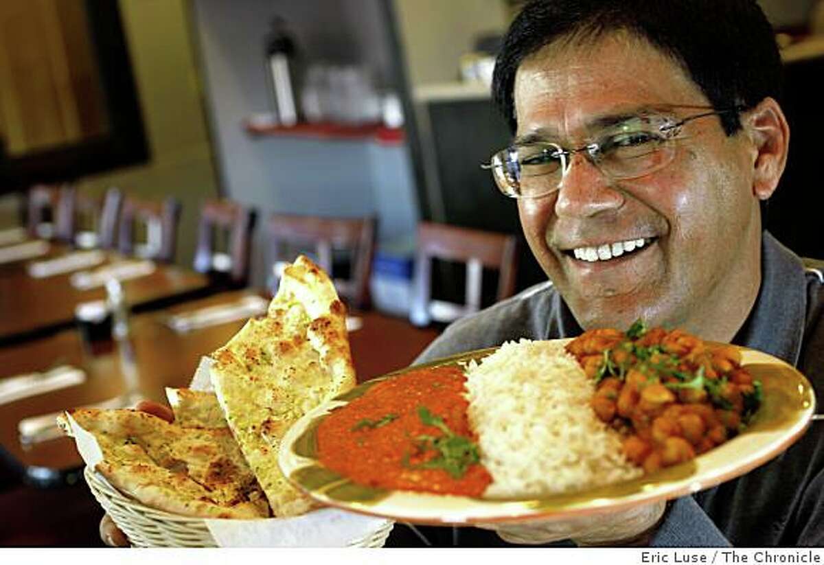 Chef Owner with a Chicken Combo Special of Chicken Tikka Masala, Daal Tadka and Naan & Rice at Kabab and Karahi restaurant in Berkeley photographed on Tuesday, February 10, 2009.
