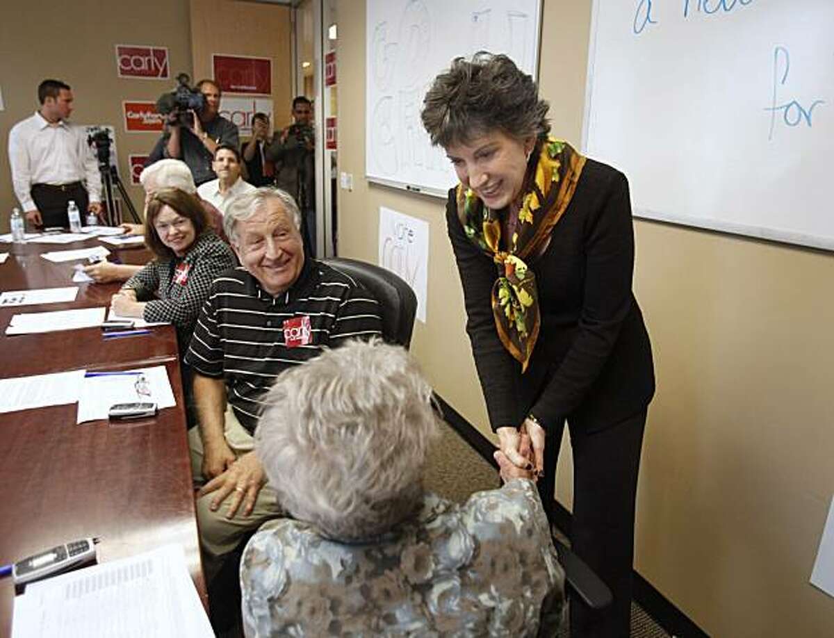 FILE - In this Oct. 4, 2010 file photo, Republican U.S. Senate candidate Carly Fiorina, thanks supporter Dona Green for volunteering to work at a phone bank at Fiorina's campaign headquarters in Sacramento, Calif., Monday, Oct. 4, 2010. Fiorina is in atight race against incumbent Democrat, U.S. Senator Barbara Boxer.