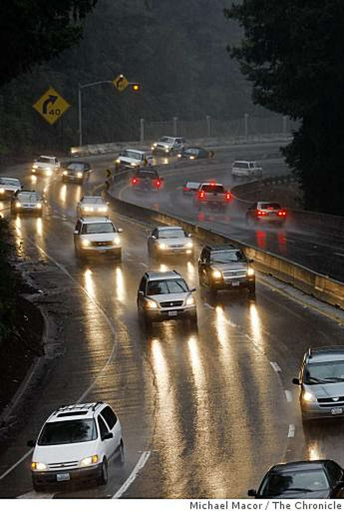 Motorists travel over the summit between Santa Cruz and Los Gatos, on Tuesday Feb. 17, 2009, as rains continue to fall along Highway 17 in the Santa Cruz Mountains.