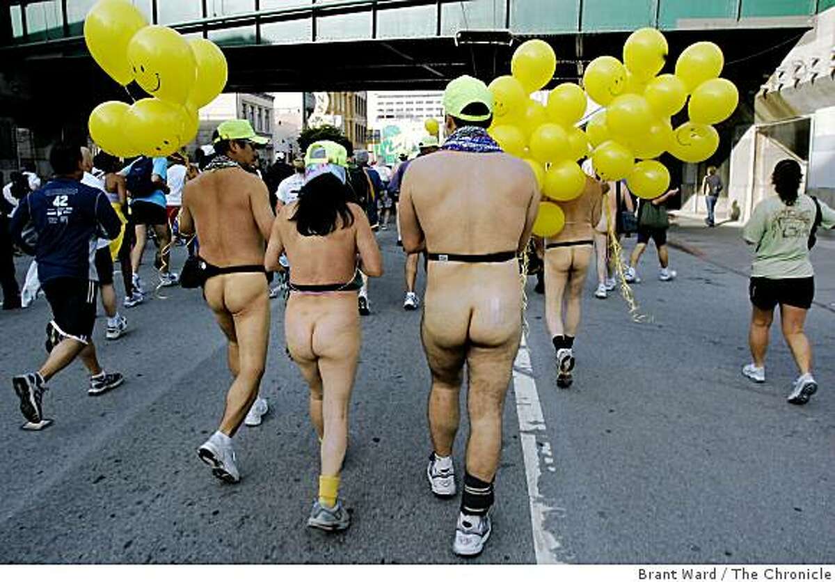 What race would be complete without the naked runners and walkers...most walked including this group with yellow balloons. The 96th annual Bay to Breakers foot race took over the streets of San Francisco Sunday morning as thousands ran from Howard and Beale Streets to Ocean Beach. {Brant Ward/San Francisco Chronicle}5/20/07