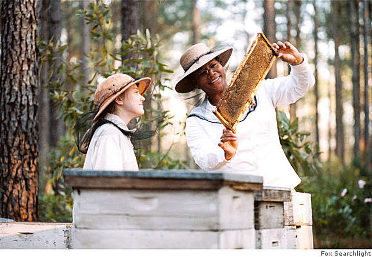 Dakota Fanning and Queen Latifah in "The Secret Life of Bees" (2008)