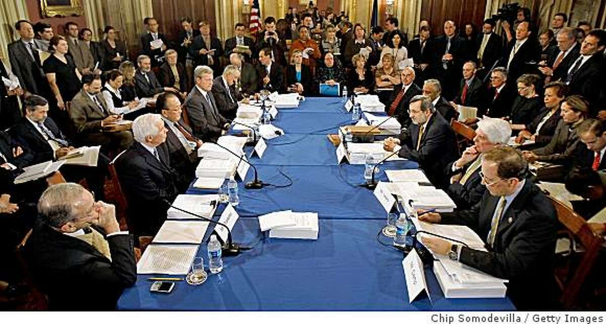 WASHINGTON - FEBRUARY 11: Surrounded by staffers and reporters, members of the Senate and House Appropriations Committees meet in conference to hash out differences between the two versions of the economic stimulus legislation in the LBJ Room at the U.S. Captiol February 11, 2009 in Washington, DC. Republican and Democratic lawmakers from the Senate and House of Representatives have agreed on a $789 billion package. (Photo by Chip Somodevilla/Getty Images)